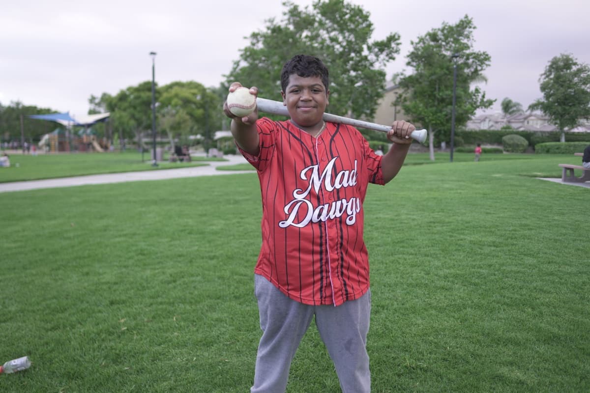 Player in MAD Dawgs pinstripe jersey