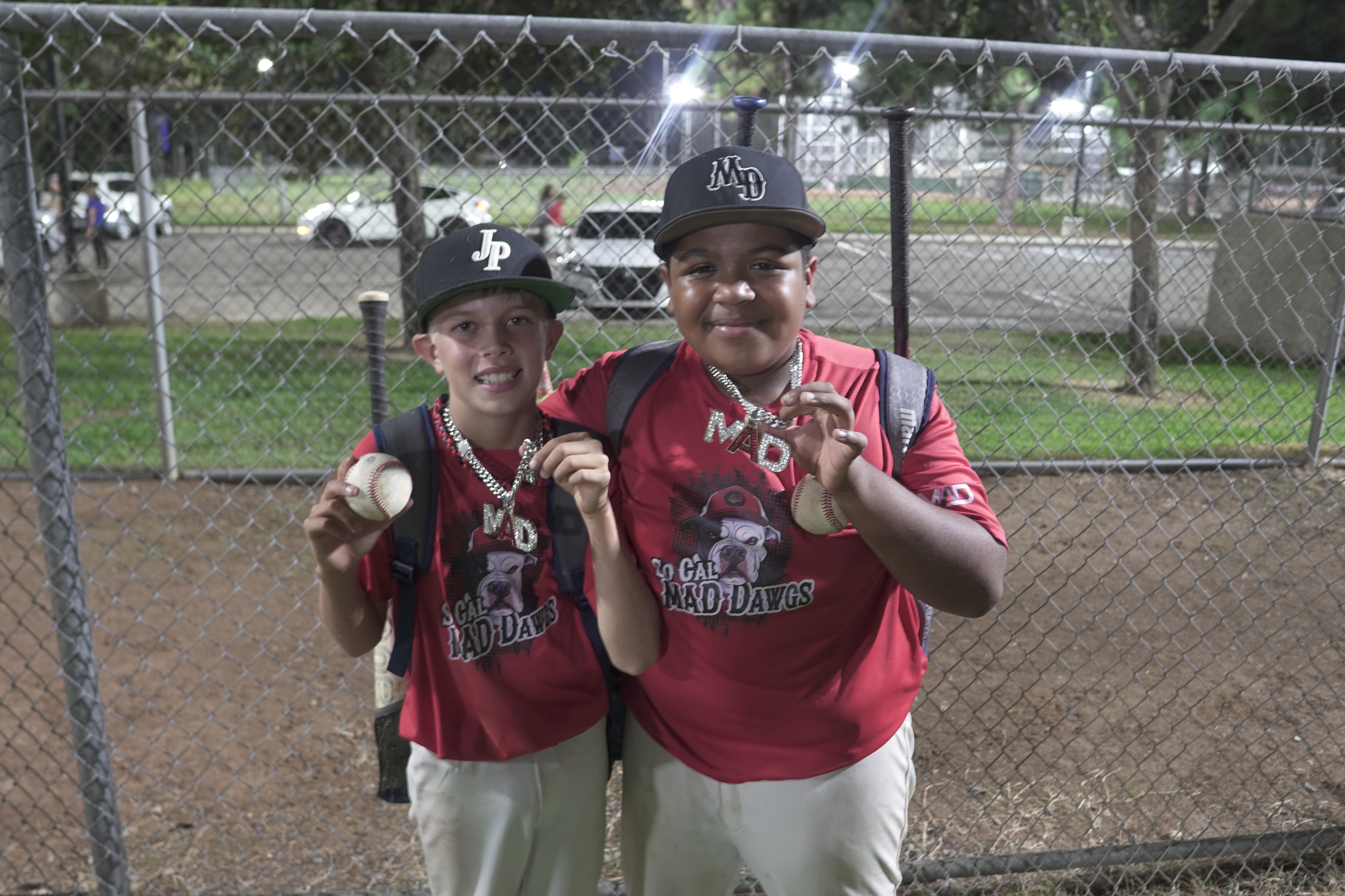 Two MAD Dawgs players at night game
