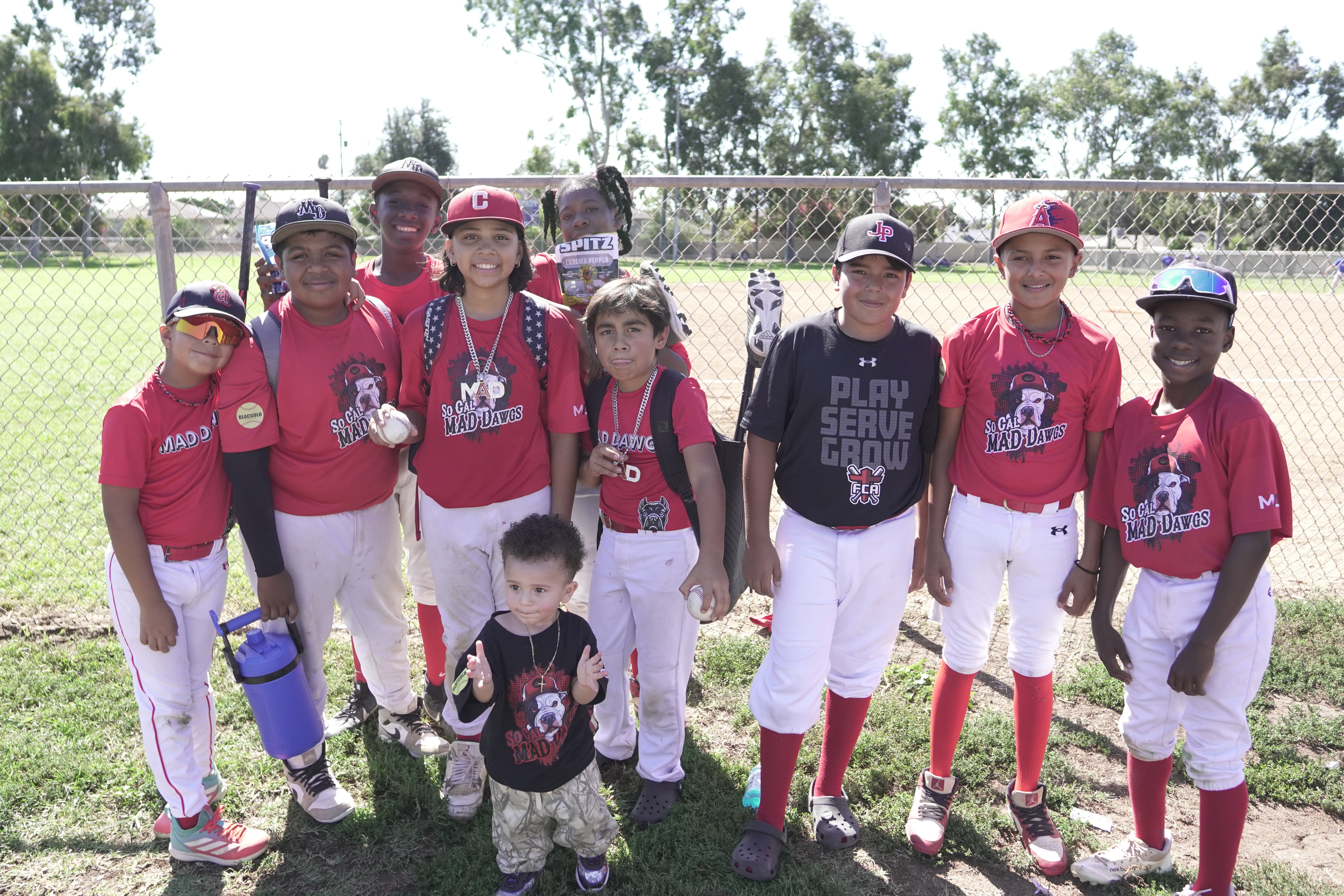 MAD Dawgs team in red uniforms at the field