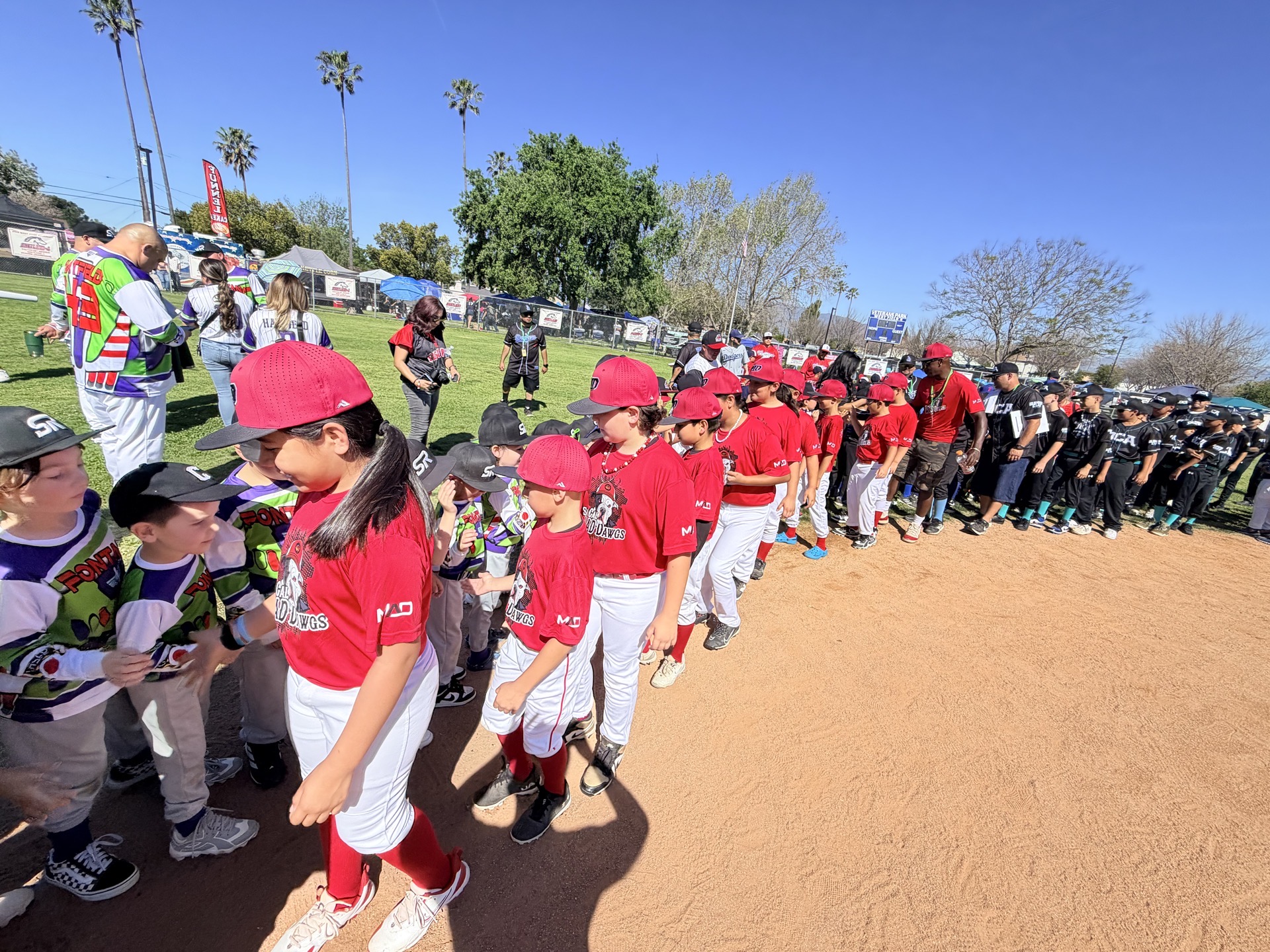 MAD Dawgs and opponents lined up for post-game handshakes