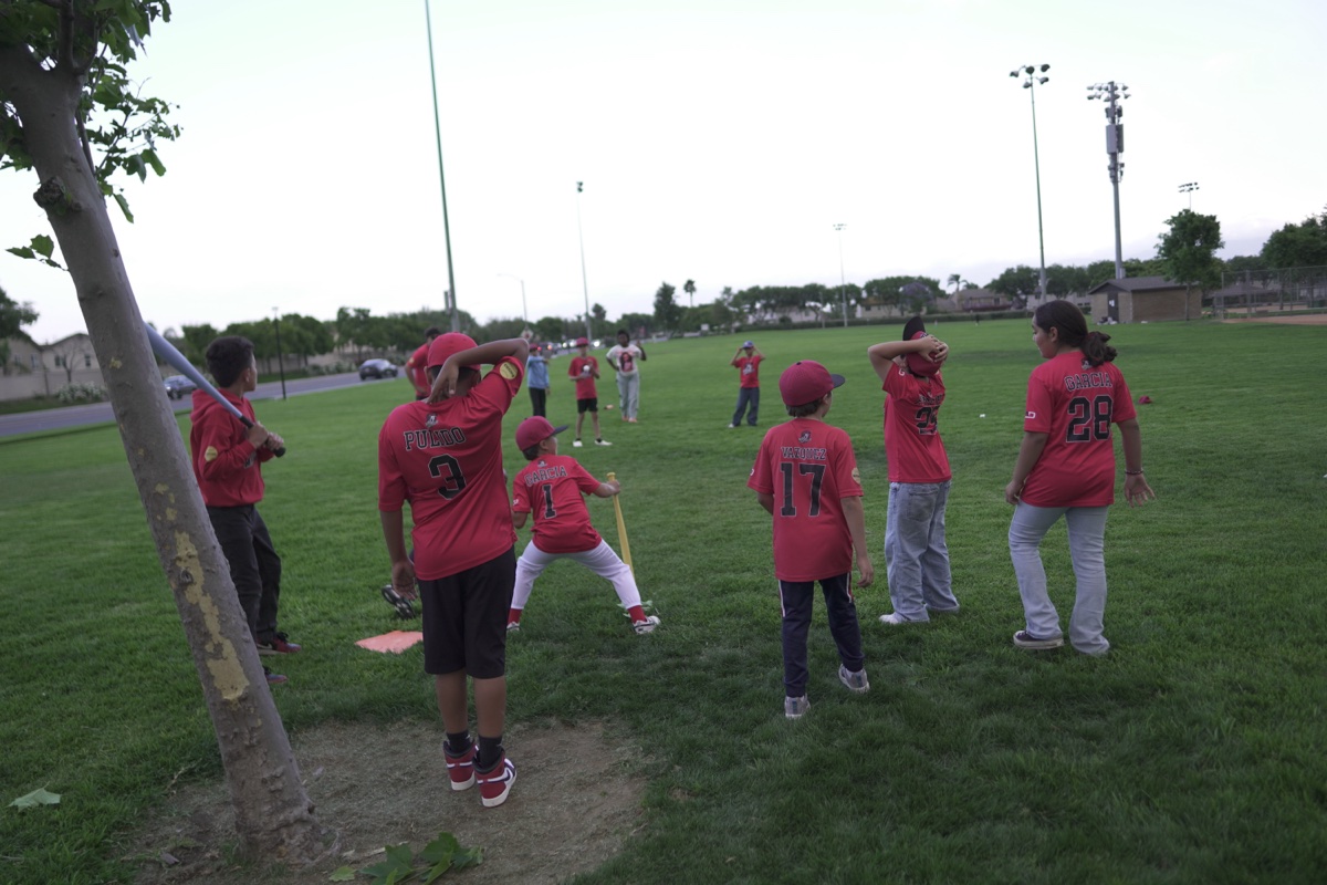 MAD Dawgs players warming up at the park